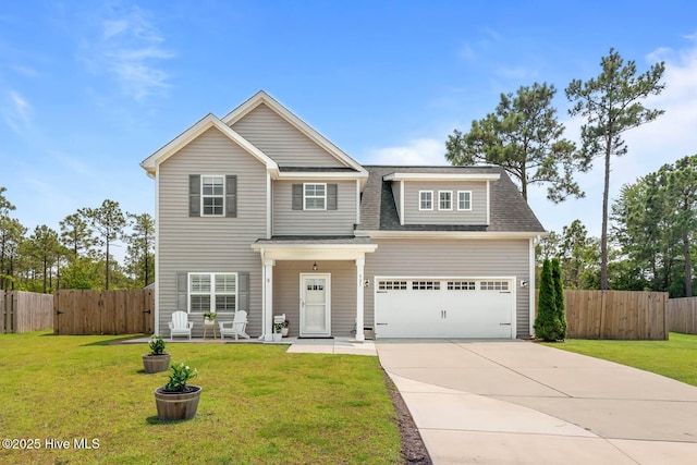 527 Everett Glades, Sneads Ferry, NC 28460 - view of front of property with driveway, a garage, and a shingled roof
