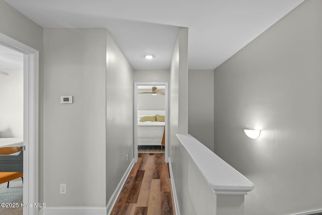 527 Everett Glades, Sneads Ferry, NC 28460 - hallway featuring wood finished floors, an upstairs landing, and baseboards