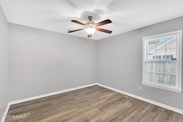 422 Point View Ct, Wilmington, NC 28411 - unfurnished room with wood finished floors, a ceiling fan, baseboards, and a textured ceiling