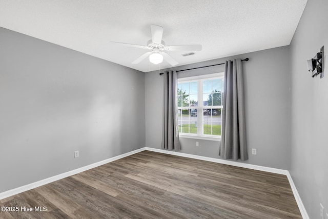 422 Point View Ct, Wilmington, NC 28411 - unfurnished room featuring wood finished floors, ceiling fan, baseboards, and a textured ceiling