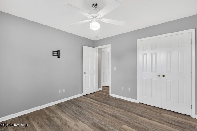 422 Point View Ct, Wilmington, NC 28411 - unfurnished bedroom with wood finished floors, baseboards, a closet, and ceiling fan