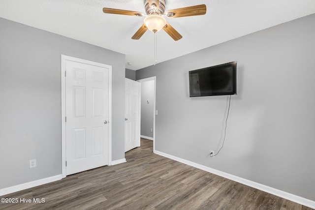 422 Point View Ct, Wilmington, NC 28411 - unfurnished bedroom with wood finished floors, baseboards, and ceiling fan