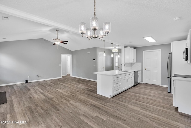 422 Point View Ct, Wilmington, NC 28411 - kitchen with appliances with stainless steel finishes, a peninsula, ceiling fan, open floor plan, and a textured ceiling