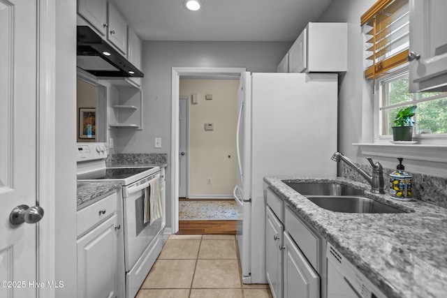 7100 Farrington Farms Dr, Wilmington, NC 28411 - kitchen featuring white appliances, under cabinet range hood, a sink, white cabinetry, and light tile patterned flooring