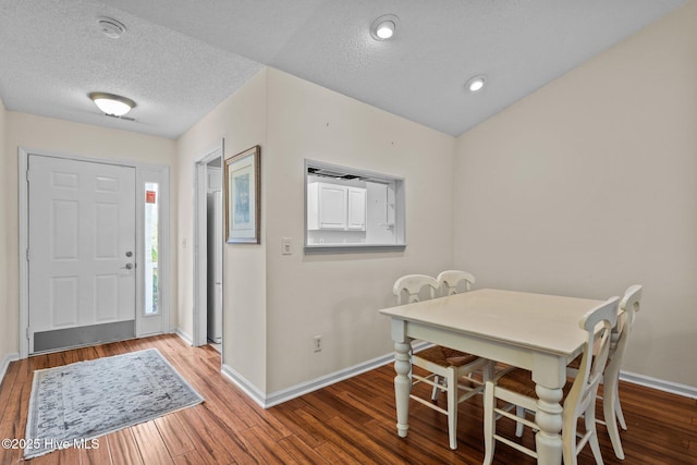 7100 Farrington Farms Dr, Wilmington, NC 28411 - foyer featuring wood finished floors, baseboards, and a textured ceiling