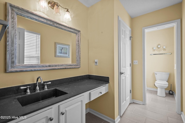 7100 Farrington Farms Dr, Wilmington, NC 28411 - bathroom with vanity, toilet, baseboards, and tile patterned floors