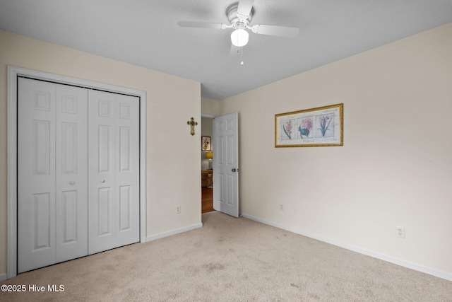 7100 Farrington Farms Dr, Wilmington, NC 28411 - unfurnished bedroom featuring carpet floors, baseboards, a closet, and ceiling fan