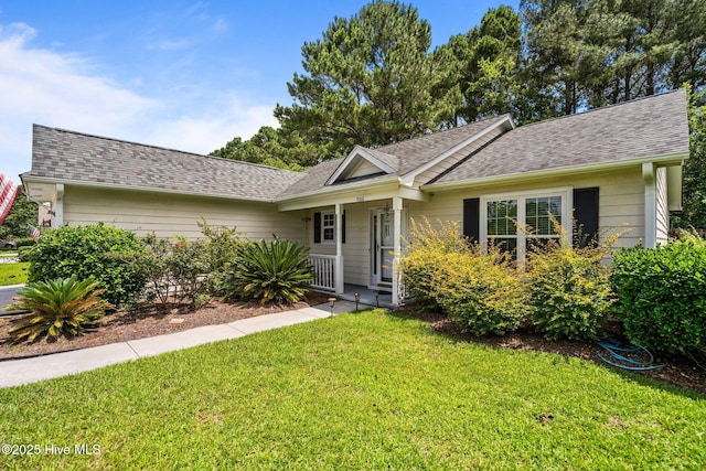 7100 Farrington Farms Dr, Wilmington, NC 28411 - view of front of property with a front yard, roof with shingles, and a porch