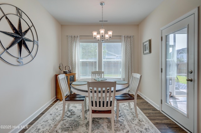 14 Thrush Trl, Hampstead, NC 28443 - dining room with a chandelier, healthy amount of natural light, and dark wood-type flooring