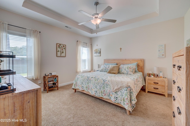 14 Thrush Trl, Hampstead, NC 28443 - bedroom with a tray ceiling, light colored carpet, baseboards, and ceiling fan