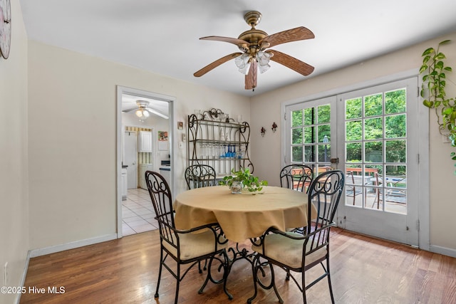 525 Mohican Trl, Wilmington, NC 28409 - dining space featuring ceiling fan, light wood-style floors, and baseboards