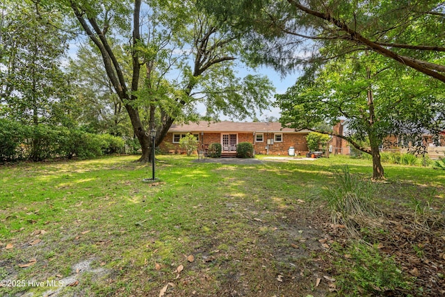 525 Mohican Trl, Wilmington, NC 28409 - view of grassy yard with a patio