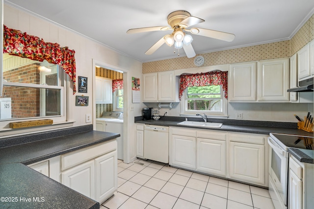 525 Mohican Trl, Wilmington, NC 28409 - kitchen with white appliances, a sink, ornamental molding, washer and clothes dryer, and a ceiling fan