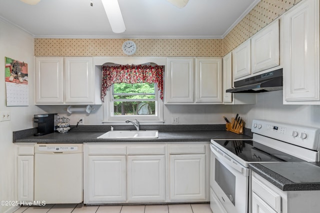 525 Mohican Trl, Wilmington, NC 28409 - kitchen featuring white appliances, a sink, under cabinet range hood, crown molding, and dark countertops
