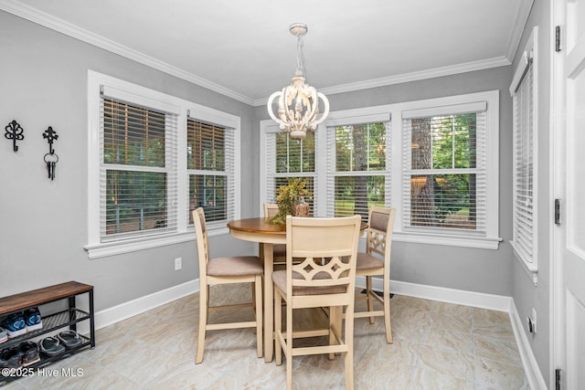 3504 Sheffield Dr, Rocky Mount, NC 27803 - dining space featuring a chandelier, ornamental molding, and baseboards