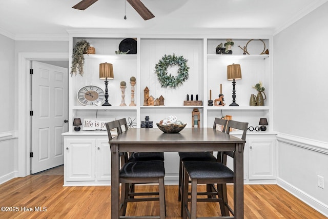 3504 Sheffield Dr, Rocky Mount, NC 27803 - dining space with light wood-style flooring, ornamental molding, a ceiling fan, and built in shelves