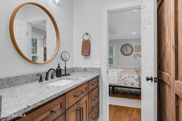3504 Sheffield Dr, Rocky Mount, NC 27803 - ensuite bathroom with vanity, crown molding, and wood finished floors