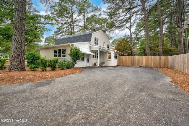 3504 Sheffield Dr, Rocky Mount, NC 27803 - view of front facade with asphalt driveway, roof with shingles, a gambrel roof, and entry steps