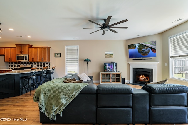 1187 S Brook Rd, Winnabow, NC 28479 - living area with a ceiling fan, light wood-style flooring, recessed lighting, and a fireplace with flush hearth
