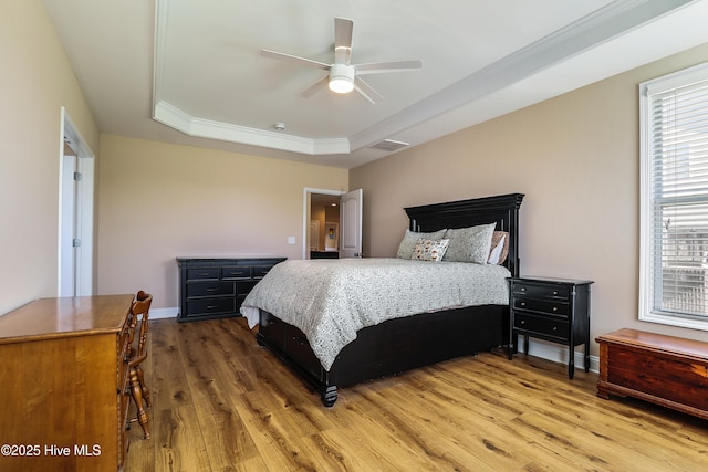 1187 S Brook Rd, Winnabow, NC 28479 - bedroom with a tray ceiling, wood finished floors, ceiling fan, and crown molding
