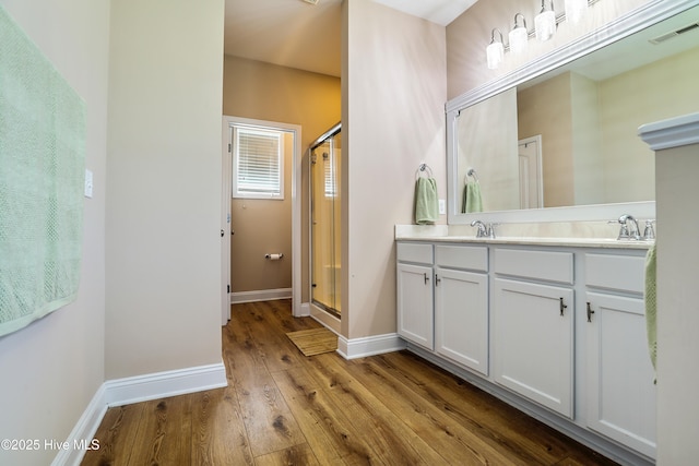 1187 S Brook Rd, Winnabow, NC 28479 - bathroom with wood finished floors, a stall shower, and double vanity
