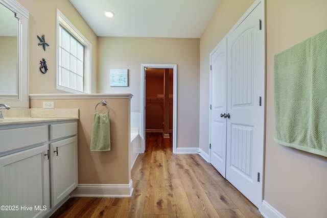 1187 S Brook Rd, Winnabow, NC 28479 - full bathroom with vanity, wood finished floors, a bath, and recessed lighting