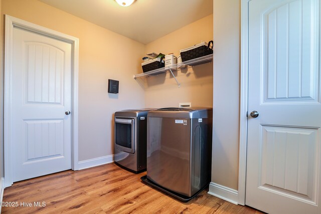 1187 S Brook Rd, Winnabow, NC 28479 - laundry room with washer and dryer and light wood-style flooring