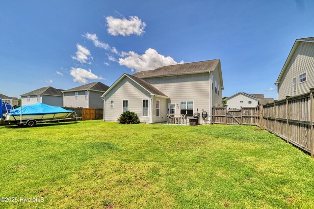 1187 S Brook Rd, Winnabow, NC 28479 - rear view of house featuring a fenced backyard and a patio area