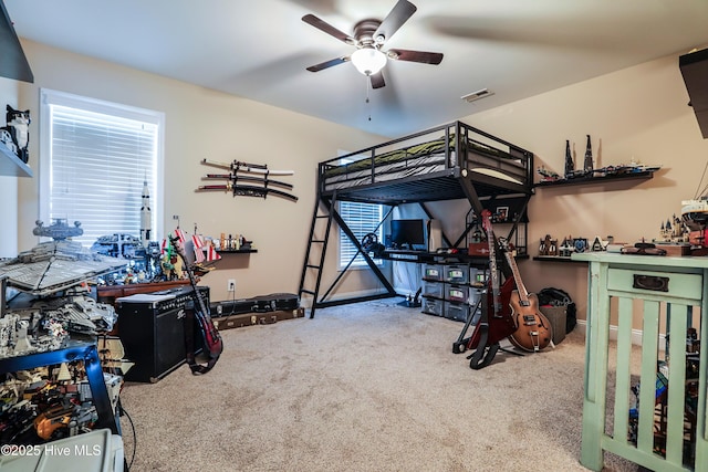 1187 S Brook Rd, Winnabow, NC 28479 - carpeted bedroom with a workshop area and a ceiling fan