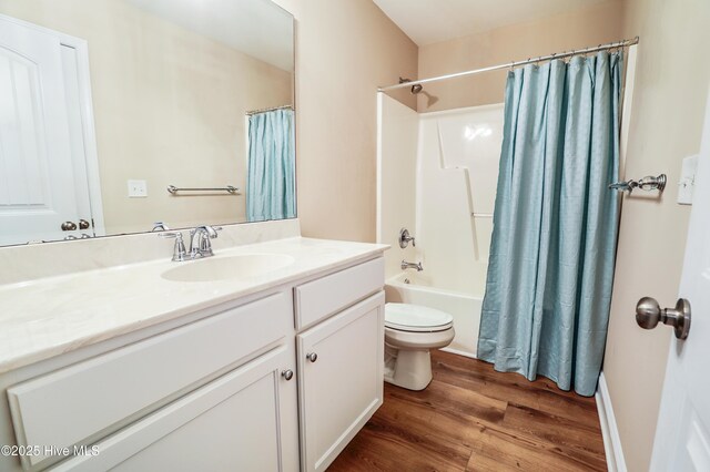 1187 S Brook Rd, Winnabow, NC 28479 - bathroom featuring wood finished floors, vanity, and shower / bath combo with shower curtain
