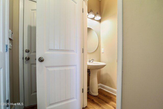 1187 S Brook Rd, Winnabow, NC 28479 - bathroom with wood finished floors and baseboards