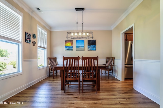 1187 S Brook Rd, Winnabow, NC 28479 - dining room featuring a chandelier, wood finished floors, and crown molding