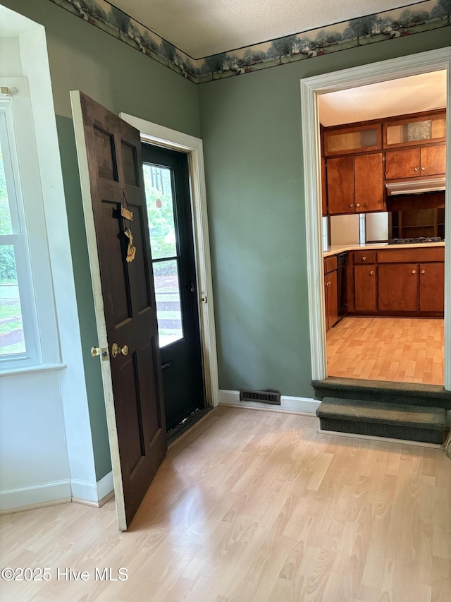 1102 Raleigh Road Parkway W, Wilson, NC 27896 - entrance foyer featuring light wood-type flooring and baseboards