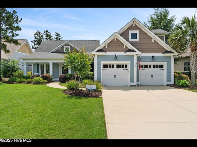 2385 Red Birch Trl NE, Leland, NC 28451 - craftsman-style house featuring driveway, a front yard, and a garage