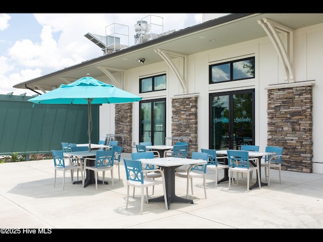 2385 Red Birch Trl NE, Leland, NC 28451 - view of patio with outdoor dining space and french doors