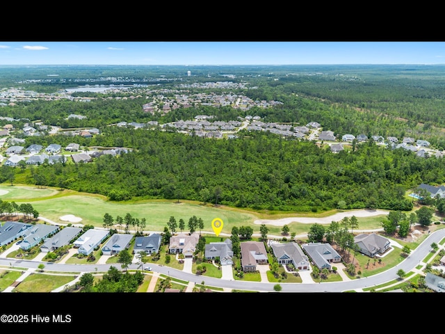 2385 Red Birch Trl NE, Leland, NC 28451 - aerial overview of property's location with nearby suburban area, a local golf course, and a heavily wooded area