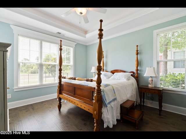 2385 Red Birch Trl NE, Leland, NC 28451 - bedroom with baseboards, wood finished floors, ornamental molding, and a tray ceiling
