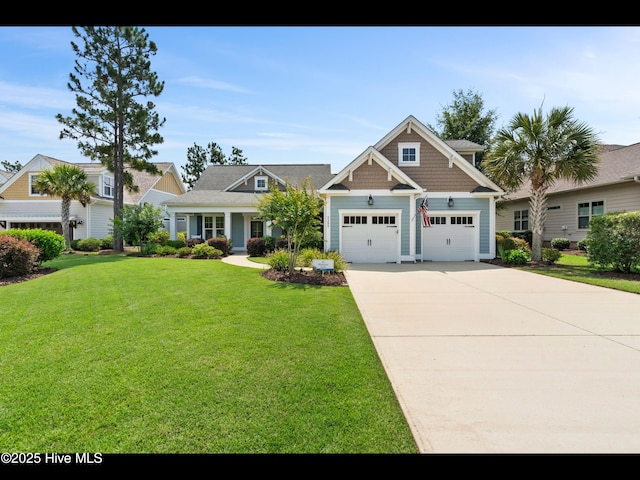 2385 Red Birch Trl NE, Leland, NC 28451 - craftsman-style home featuring a front lawn, driveway, and an attached garage