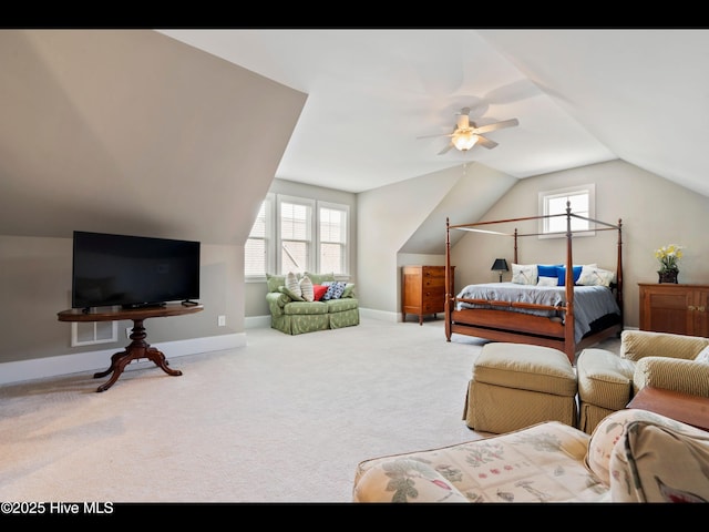 2385 Red Birch Trl NE, Leland, NC 28451 - bedroom featuring lofted ceiling, baseboards, multiple windows, carpet, and a ceiling fan