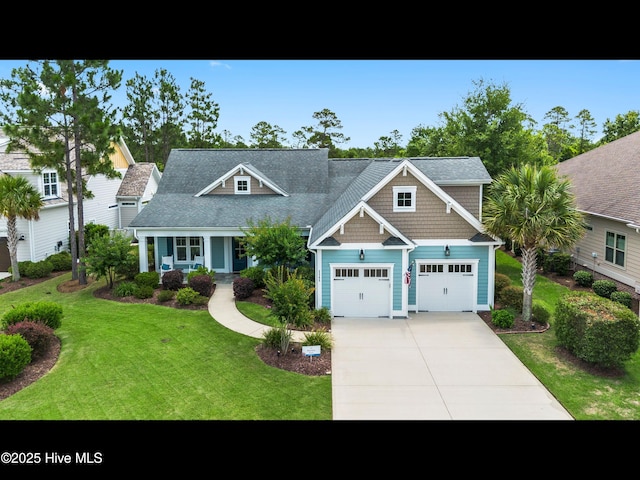 2385 Red Birch Trl NE, Leland, NC 28451 - craftsman house featuring concrete driveway and a front yard