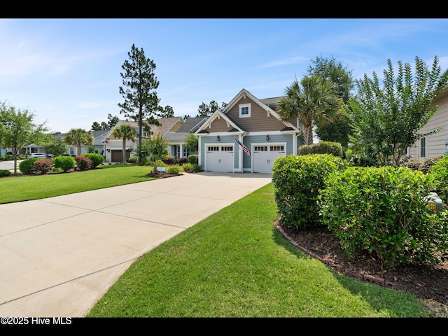 2385 Red Birch Trl NE, Leland, NC 28451 - craftsman-style house with a garage, driveway, and a front yard