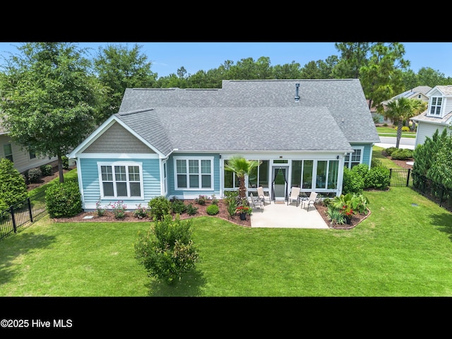 2385 Red Birch Trl NE, Leland, NC 28451 - back of property with a patio area and roof with shingles