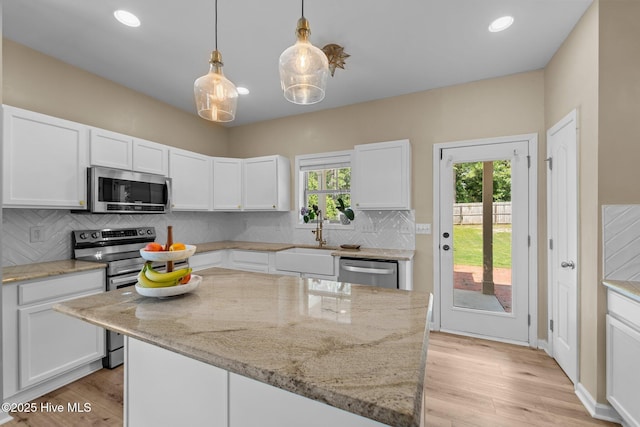 433 Shepherd Trl, Aberdeen, NC 28315 - kitchen with appliances with stainless steel finishes, white cabinets, light stone counters, backsplash, and recessed lighting