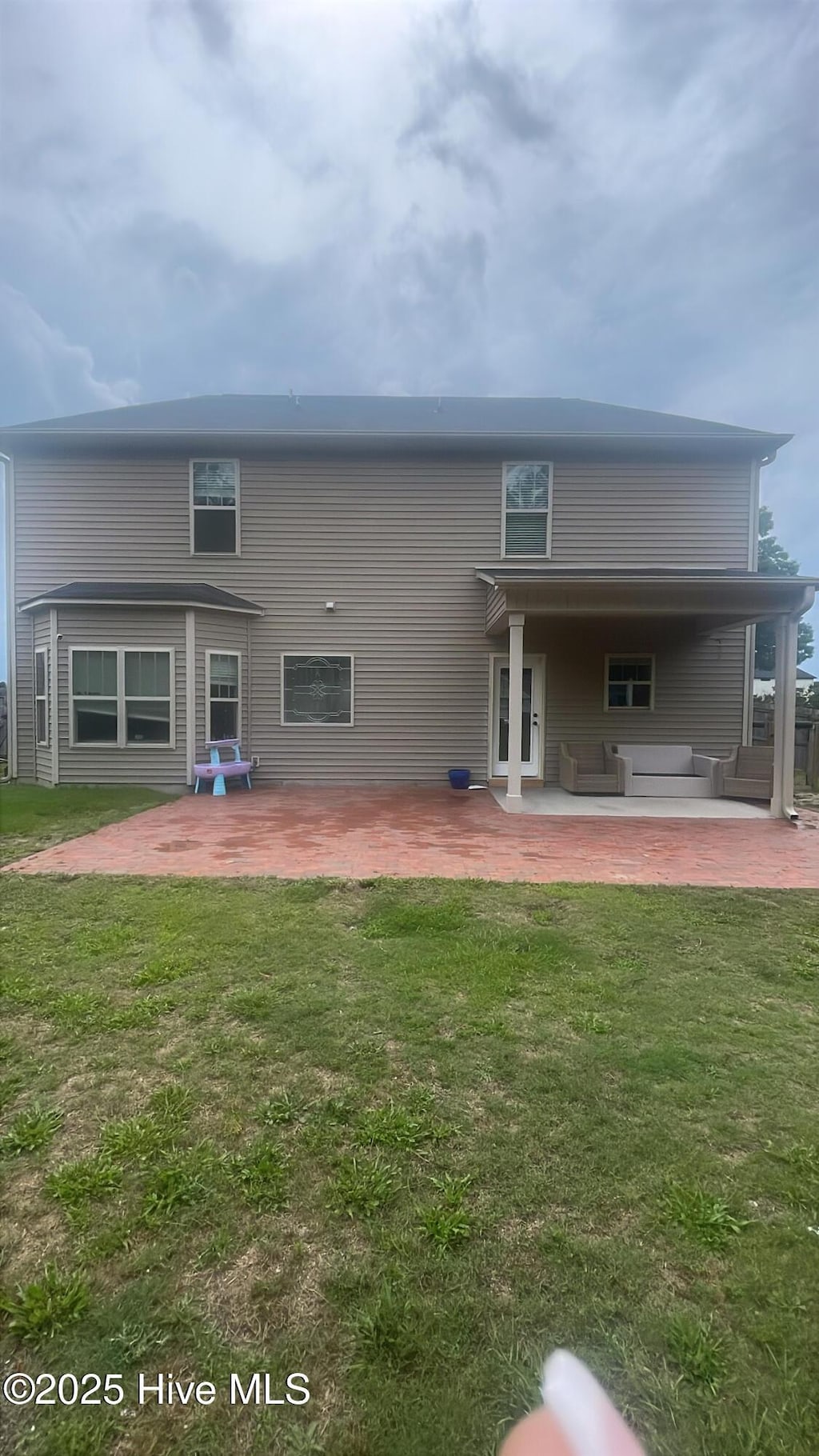 433 Shepherd Trl, Aberdeen, NC 28315 - back of house with a patio area, outdoor lounge area, and a yard