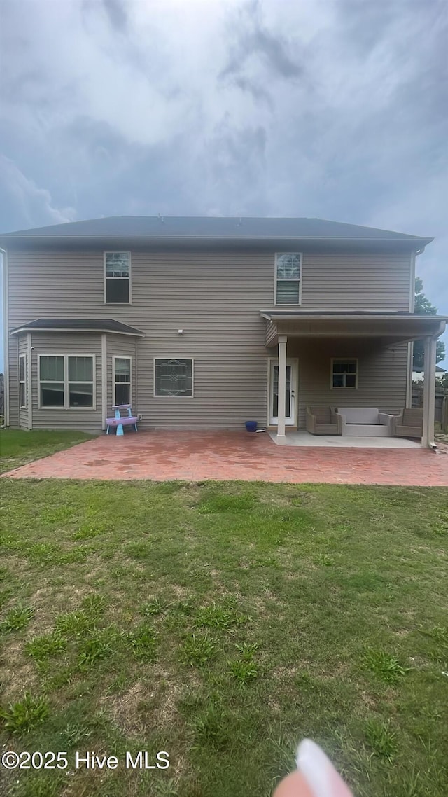 433 Shepherd Trl, Aberdeen, NC 28315 - back of house with a patio area, outdoor lounge area, and a yard