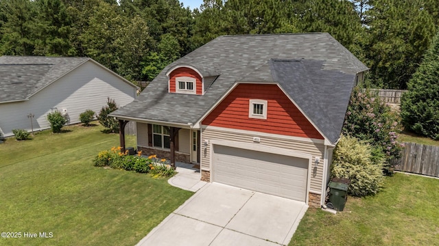 433 Shepherd Trl, Aberdeen, NC 28315 - view of front of home with a garage, driveway, covered porch, and stone siding
