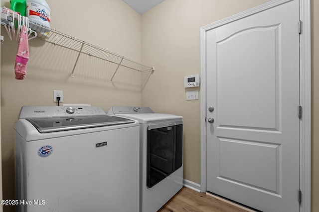 433 Shepherd Trl, Aberdeen, NC 28315 - washroom with washing machine and dryer and light wood-type flooring