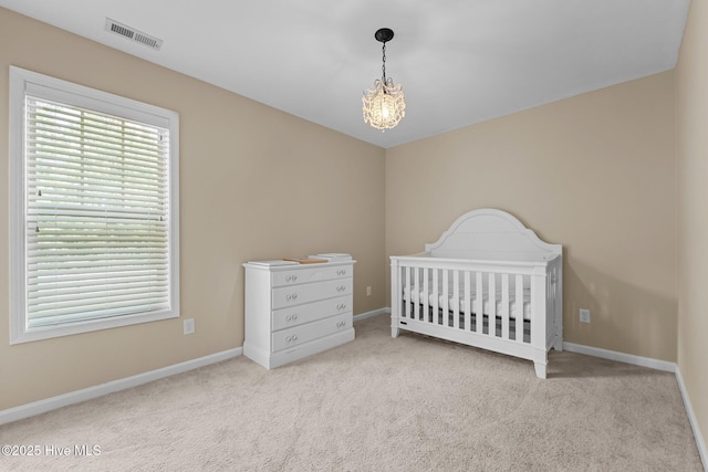433 Shepherd Trl, Aberdeen, NC 28315 - carpeted bedroom with a chandelier and a nursery area