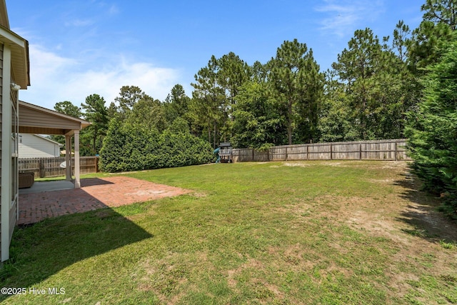 433 Shepherd Trl, Aberdeen, NC 28315 - fenced backyard with a patio area and a playground