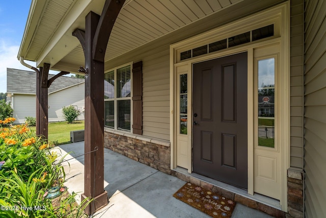 433 Shepherd Trl, Aberdeen, NC 28315 - property entrance with covered porch and stone siding